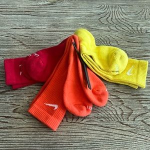 NWT: Nike dri-fit crew socks in red, orange and yellow.